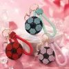 A blue diamond-encrusted football-shaped keychain with a light green braided rope handle Specification image